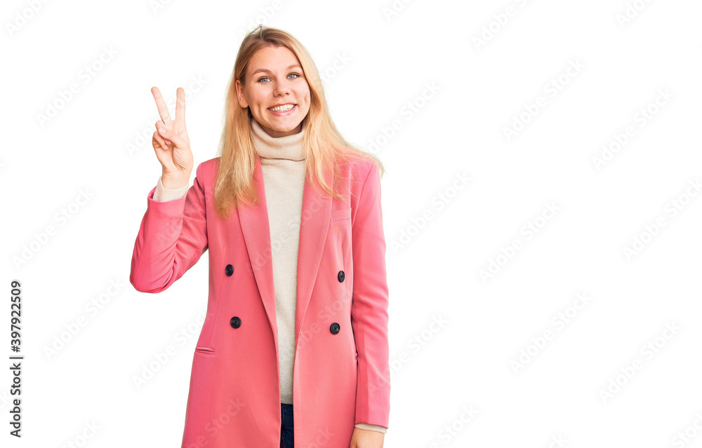 Young beautiful blonde woman wearing elegant clothes showing and pointing up with fingers number two while smiling confident and happy. Young beautiful blonde woman wearing elegant clothes showing and pointing up with fingers number two while smiling confident and happy.
