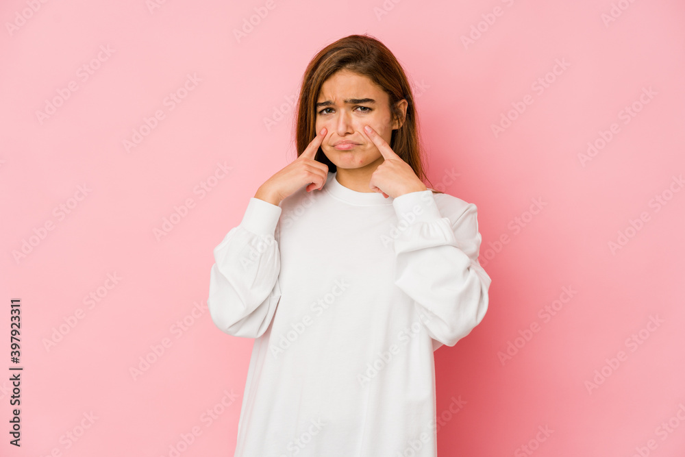 Young skinny caucasian teenager girl crying, unhappy with something, agony and confusion concept. Young skinny caucasian teenager girl crying, unhappy with something, agony and confusion concept.