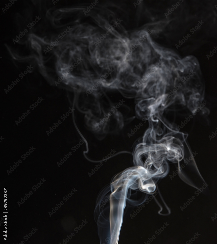 Abstract puffs of smoke on a black background. Abstract puffs of smoke on a black background.