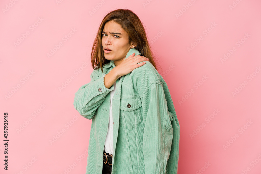 Young skinny caucasian teenager girl having a shoulder pain. Young skinny caucasian teenager girl having a shoulder pain.