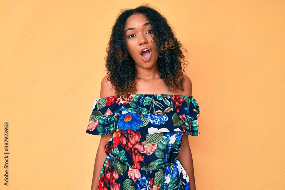 Young african american woman wearing casual clothes afraid and shocked with surprise expression, fear and excited face. Young african american woman wearing casual clothes afraid and shocked with surprise expression, fear and excited face.