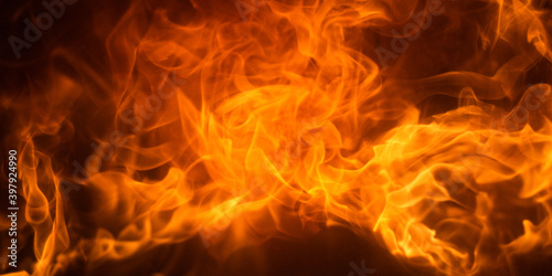 Fire flame background. Burning fireplace. Fireplace texture. Abstract flames, Burning concept.