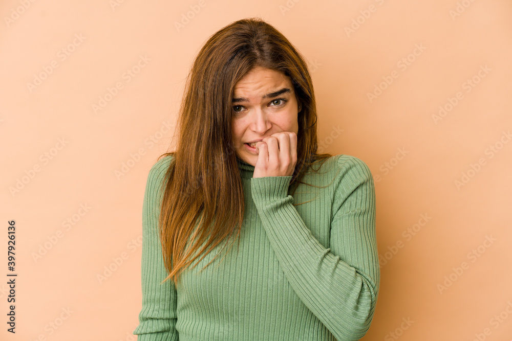Young skinny caucasian teenager girl biting fingernails, nervous and very anxious. Young skinny caucasian teenager girl biting fingernails, nervous and very anxious.