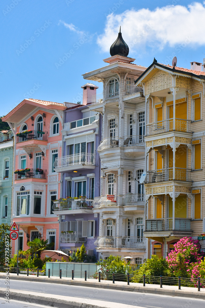 Bright colorful houses in Istanbul Bosphorus coastline. Arnavutkoy is popular, trendy and historical place near seaside. 