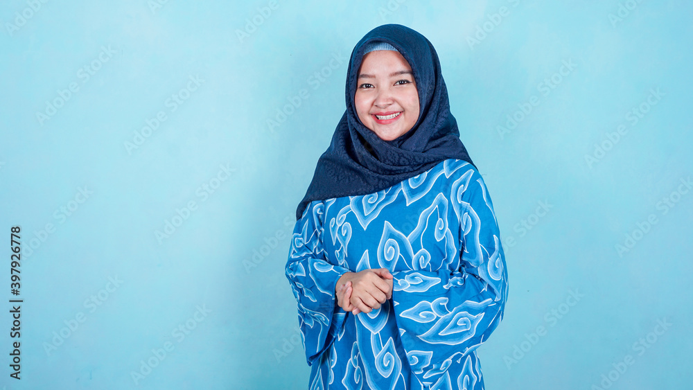 Image of happy asian hijab business woman posing isolated background Image of happy asian hijab business woman posing isolated background