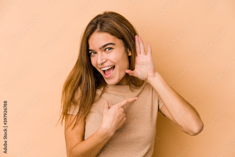 Fototapeta premium Young skinny caucasian teenager girl trying to listening a gossip.