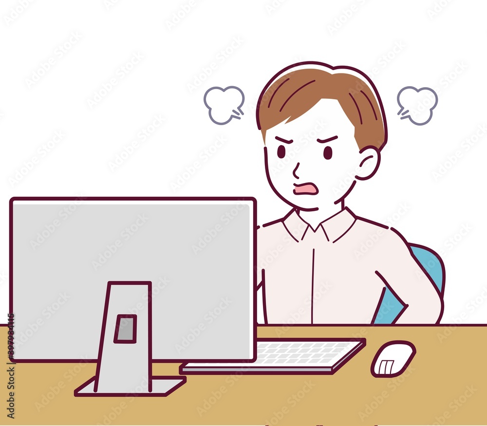 A man in a pink shirt using a computer A man in a pink shirt using a computer