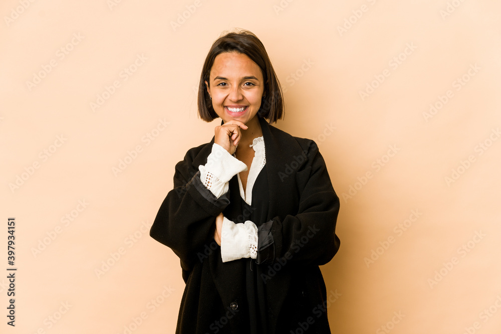 Young hispanic woman isolated smiling happy and confident, touching chin with hand. Young hispanic woman isolated smiling happy and confident, touching chin with hand.