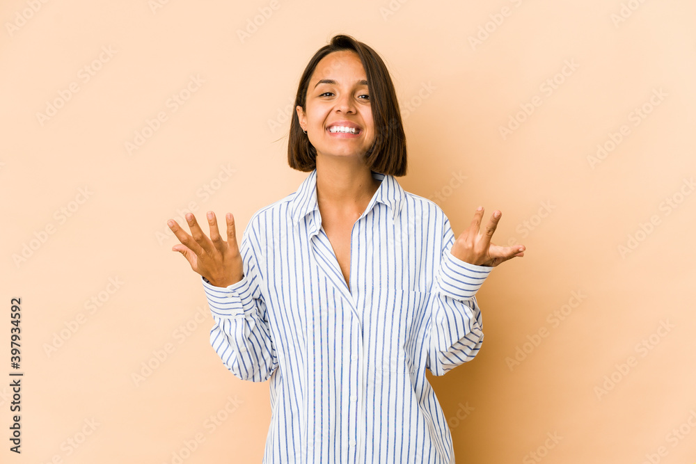 Young hispanic woman isolated laughs out loudly keeping hand on chest. Young hispanic woman isolated laughs out loudly keeping hand on chest.