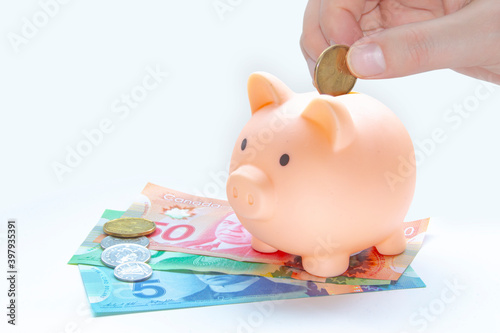 Photos A person saving Canadian currency