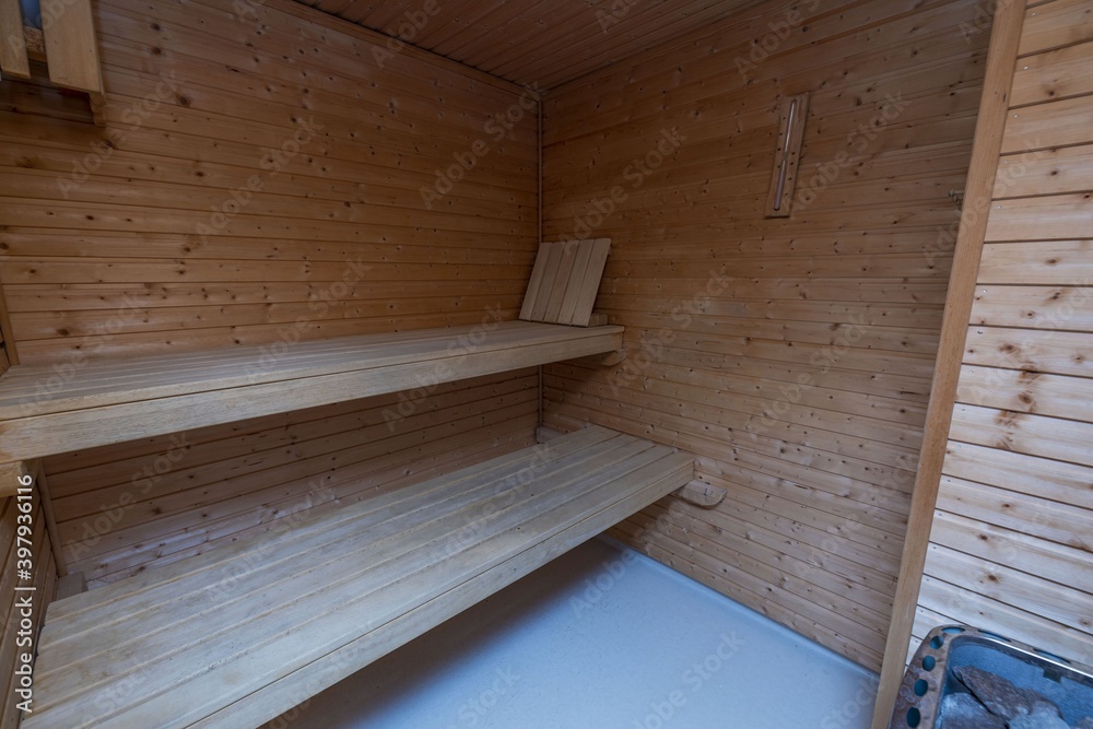 View of sauna room interior. Wooden walls and seats. Health concept. - obrazy, fototapety, plakaty 