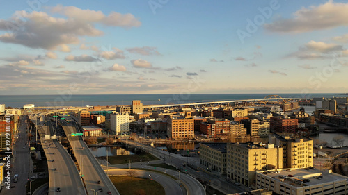 Aerial view of American city at sunset. Modern buildings  skyscrapers. Cloudy sky  cityscape. Milwaukee  Wisconsin