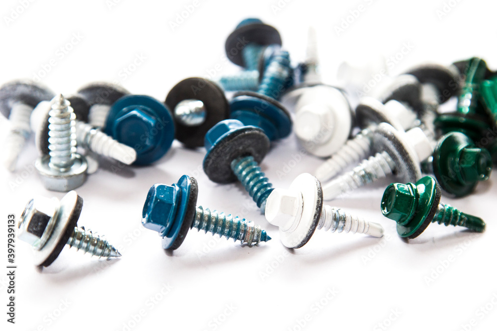 Screws of metallic, white, blue and green colors mixed Screws of metallic, white, blue and green colors mixed