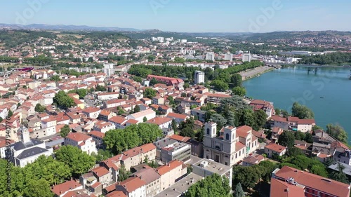 Picturesque view from drone of Givors summer cityscape on Rhone riverbanks, Auvergne-Rhone-Alpes region, France photo