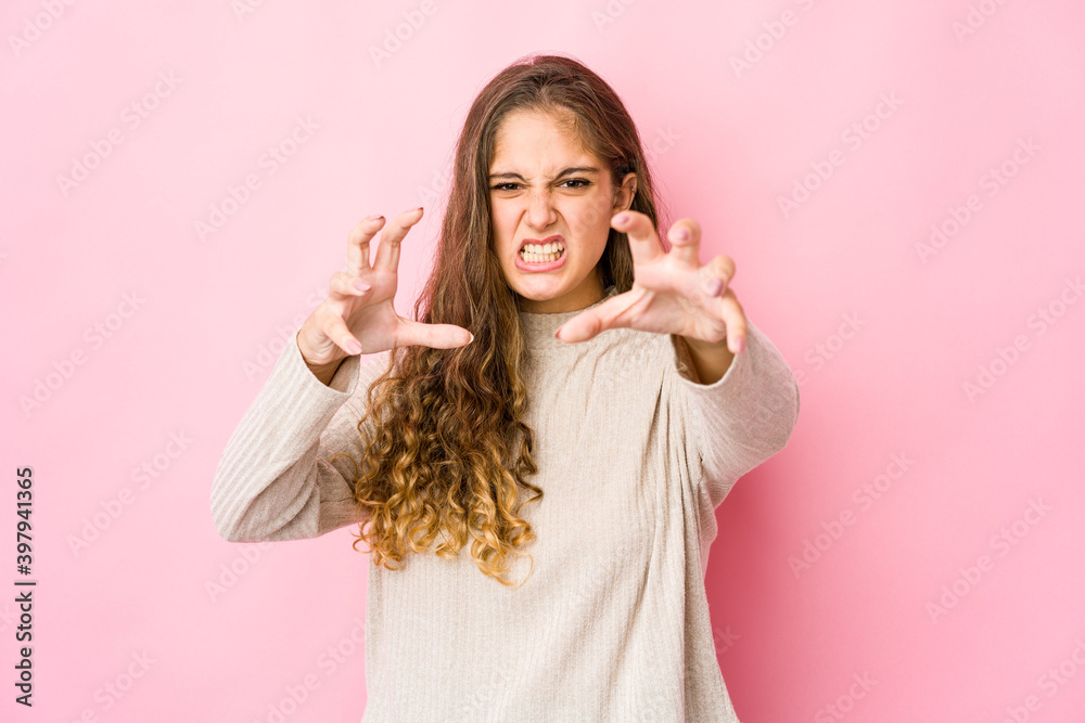 Young caucasian woman upset screaming with tense hands. Young caucasian woman upset screaming with tense hands.