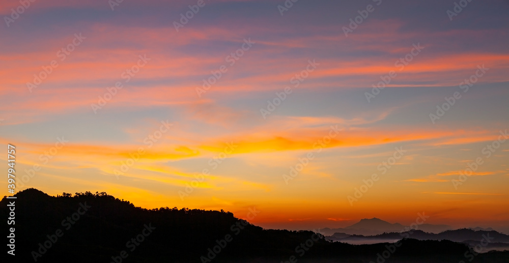 Beautiful light sunrise or sunset Landscape nature view Dramatic sky colorful clouds over mountain in the morning