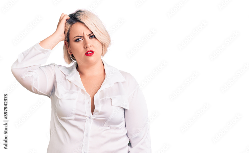 Young blonde plus size woman wearing casual shirt confuse and wonder about question. uncertain with doubt, thinking with hand on head. pensive concept.