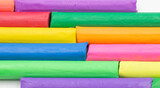 multi colors of clay sticks on white