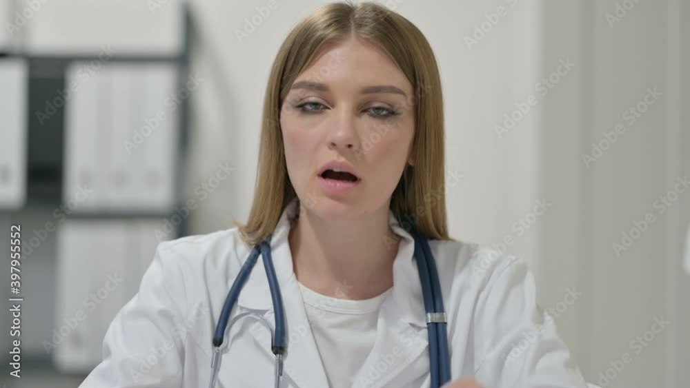 Portrait of Young Female Doctor Talking on Video Chat Portrait of Young Female Doctor Talking on Video Chat