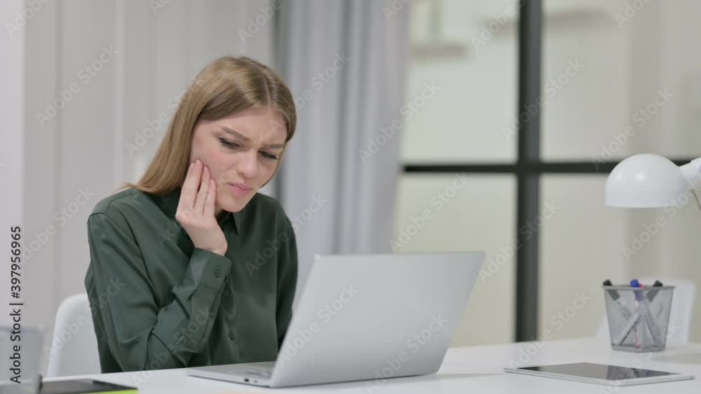 Woman having Toothache While Drinking Coffee at Work Woman having Toothache While Drinking Coffee at Work