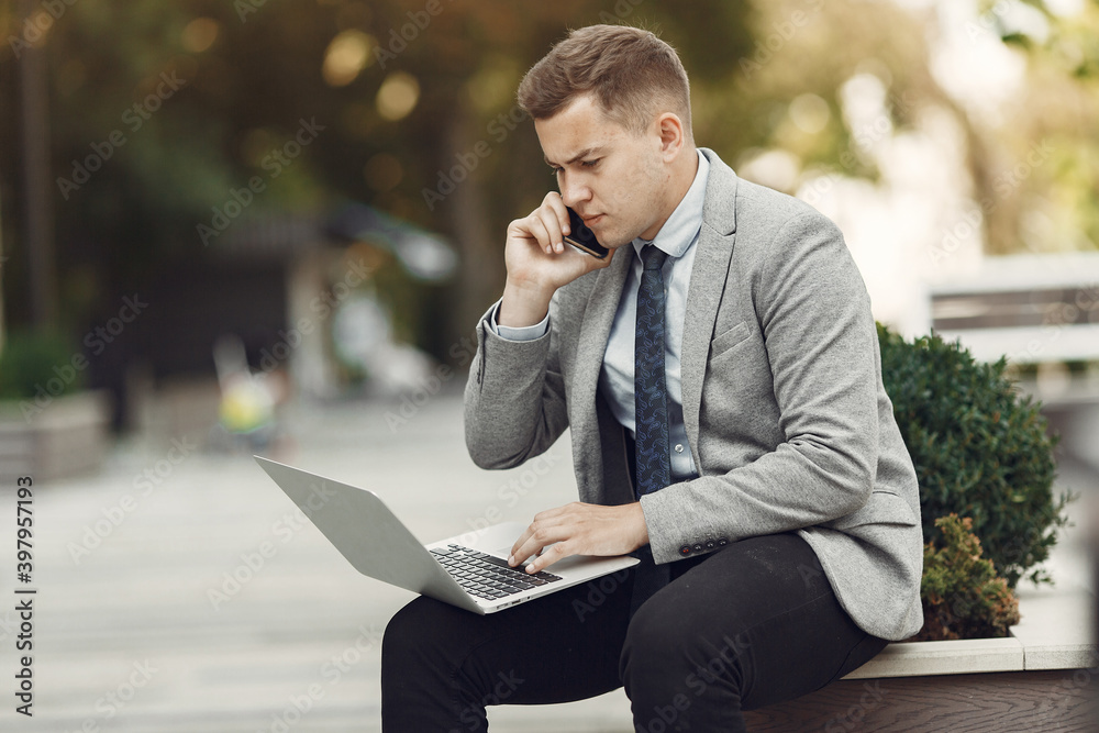 Businessman. Guy in a suit. Male use a laptop. Businessman. Guy in a suit. Male use a laptop.