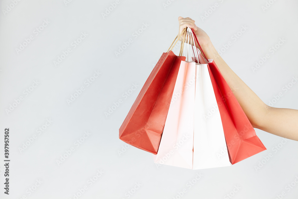 Bags for shopping in hand on a white background. Paper bags for shopping