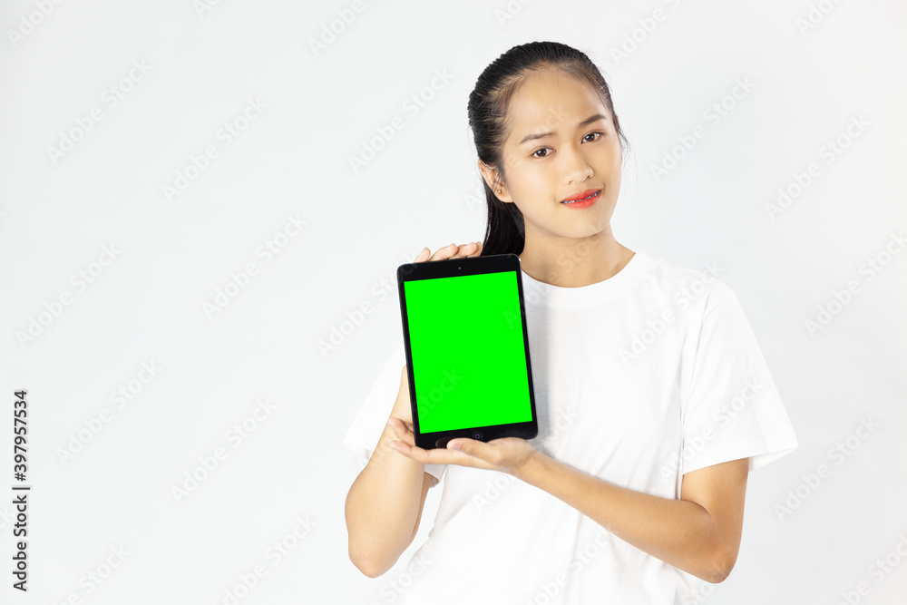 Young beautiful woman in white t-shirt holding and showing blank green screen tablet for your write a content on the white studio background
Young beautiful woman in white t-shirt holding and showing blank green screen tablet for your write a content on the white studio background