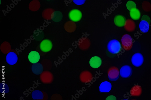 Abstract light bokeh at night party in winter. Christmas blurred lights bokeh background.