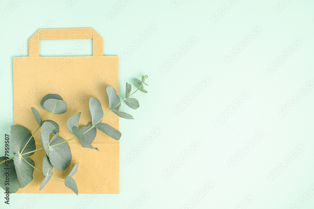 Brown paper bag on green background. Zero waste, Eco friendly. Brown paper bag on green background. Zero waste, Eco friendly.