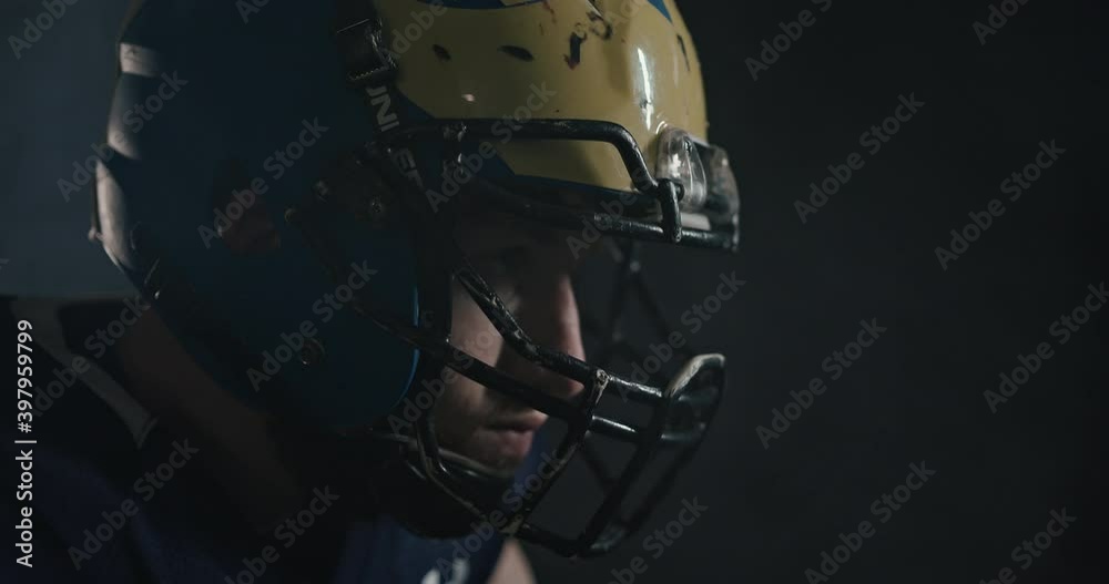 American football sportsman player raising his head. Getting ready for the game