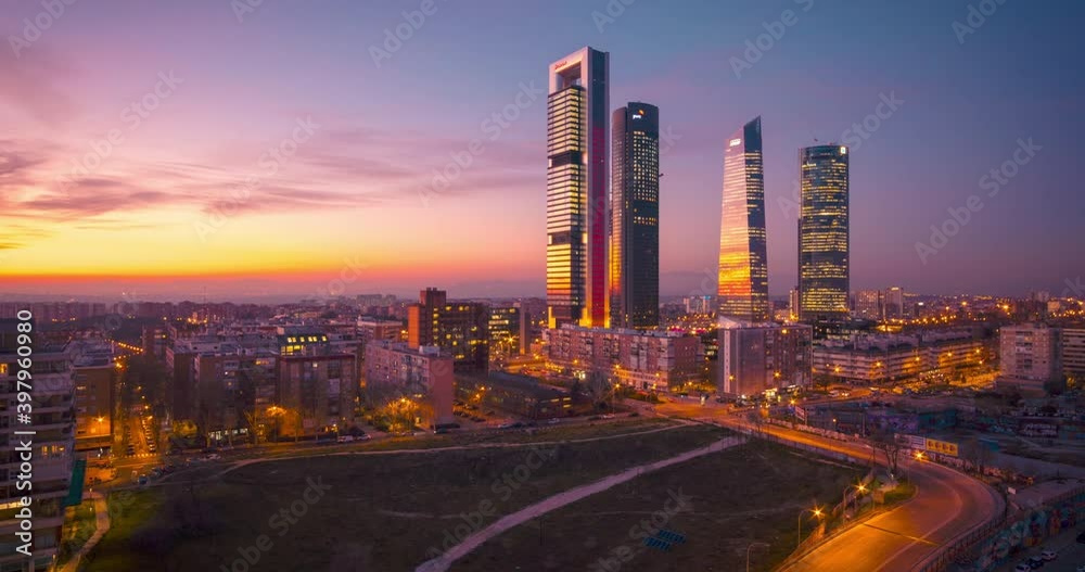 Hyperlapse drone aerial view of Madrid Four tower now Five Towers business area. Timelapse during sunset