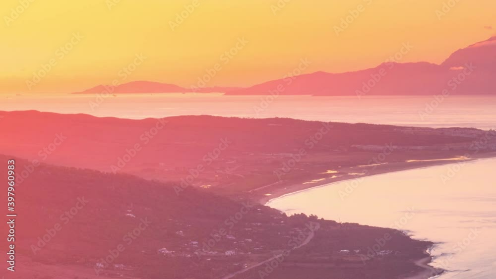 Close up view Sunrise timelapse strait of Gibraltar in a summer morning. Boats and cargo boats passing by. Tarifa and Ceuta view Close up view Sunrise timelapse strait of Gibraltar in a summer morning. Boats and cargo boats passing by. Tarifa and Ceuta view