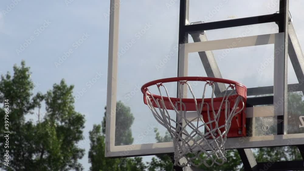 Training Throw of the Ball. The ball enters the basket basketball. Slow Motion at a rate of 240 fps Training Throw of the Ball. The ball enters the basket basketball. Slow Motion at a rate of 240 fps