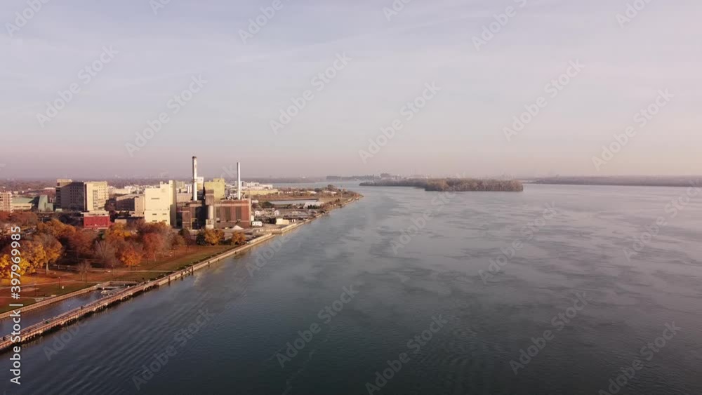 Flying Towards Shut Down Power Plant Station Of Wyandotte Michigan City At Detroit River During Fall Season. - Drone Shot Flying Towards Shut Down Power Plant Station Of Wyandotte Michigan City At Detroit River During Fall Season. - Drone Shot
