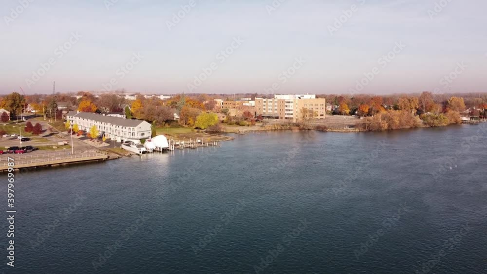 Drone Flying Towards Trenton City With Bright Autumn Foliage Landscape During Daylight In Wayne County, Michigan Near Detroit River. - Aerial Shot Drone Flying Towards Trenton City With Bright Autumn Foliage Landscape During Daylight In Wayne County, Michigan Near Detroit River. - Aerial Shot