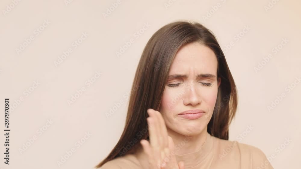Portrait of sick girl feel bad in studio. Close up of young woman with cold symptoms. Portrait of woman with season allergy. Allergic rhinitis person. Sneezing girl with flu virus. Portrait of sick girl feel bad in studio. Close up of young woman with cold symptoms. Portrait of woman with season allergy. Allergic rhinitis person. Sneezing girl with flu virus.