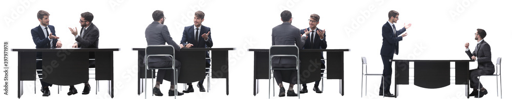 callage. two business people sitting at the Desk callage. two business people sitting at the Desk