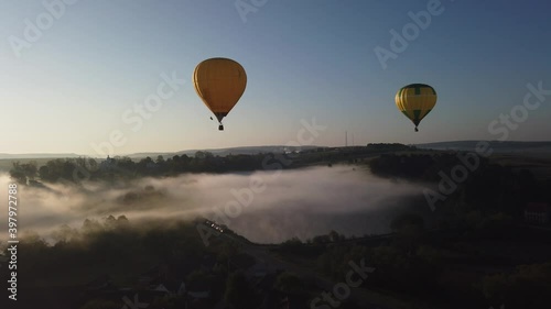 Colourful Red Blue Yellow Colours Hot Air Baloons Aerial Drone Flight Over Beautiful Autumn Forrest at Sunet Mountains Beautiful Landscape Background Sunny Vacation Travel Destination Concept