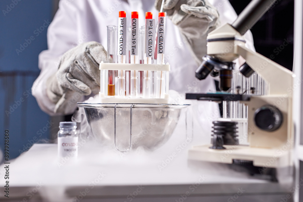 man scientist conducts research or experiment with test coronavirus tubes in chemistry or biology laboratory, experiments in smoke man scientist conducts research or experiment with test coronavirus tubes in chemistry or biology laboratory, experiments in smoke