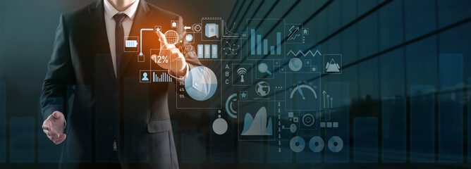 Business consultant using virtual screen on dark background