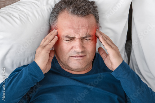 Mature man suffering from h...