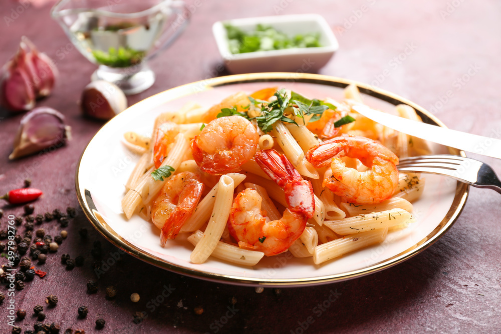 Plate of tasty pasta with shrimps on table Plate of tasty pasta with shrimps on table