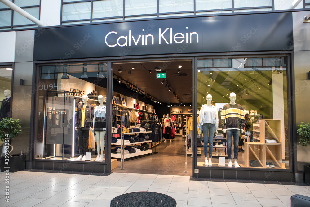 Exterior of Calvin Klein fashion clothing store shop showing company logo,  sign, signage and branding. Inside shopping centre mall Stock Photo | Adobe  Stock