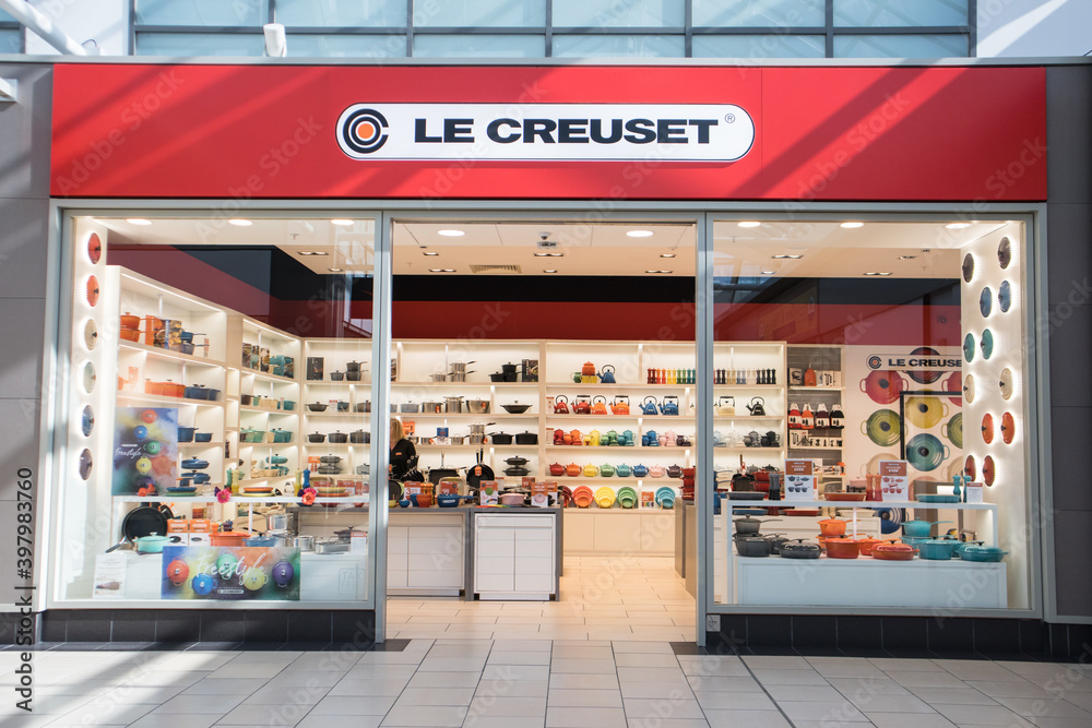 Exterior of Le Creuset store shop showing company logo, sign, signage