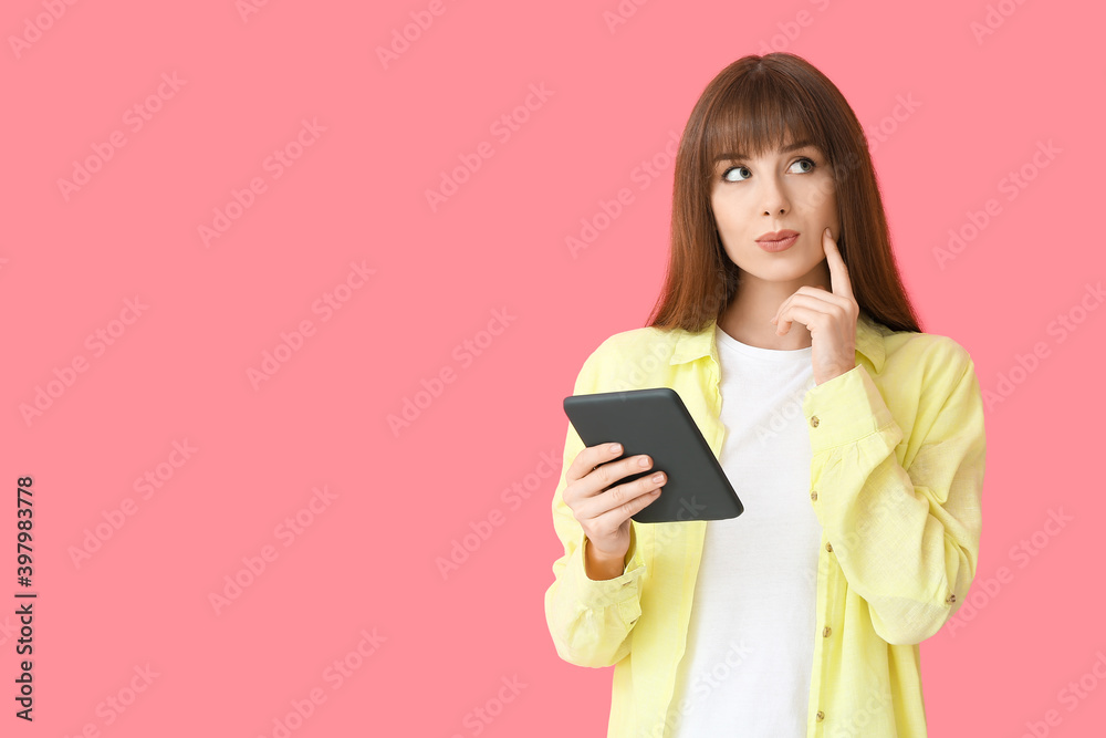 Thoughtful young woman with e-reader on color background Thoughtful young woman with e-reader on color background