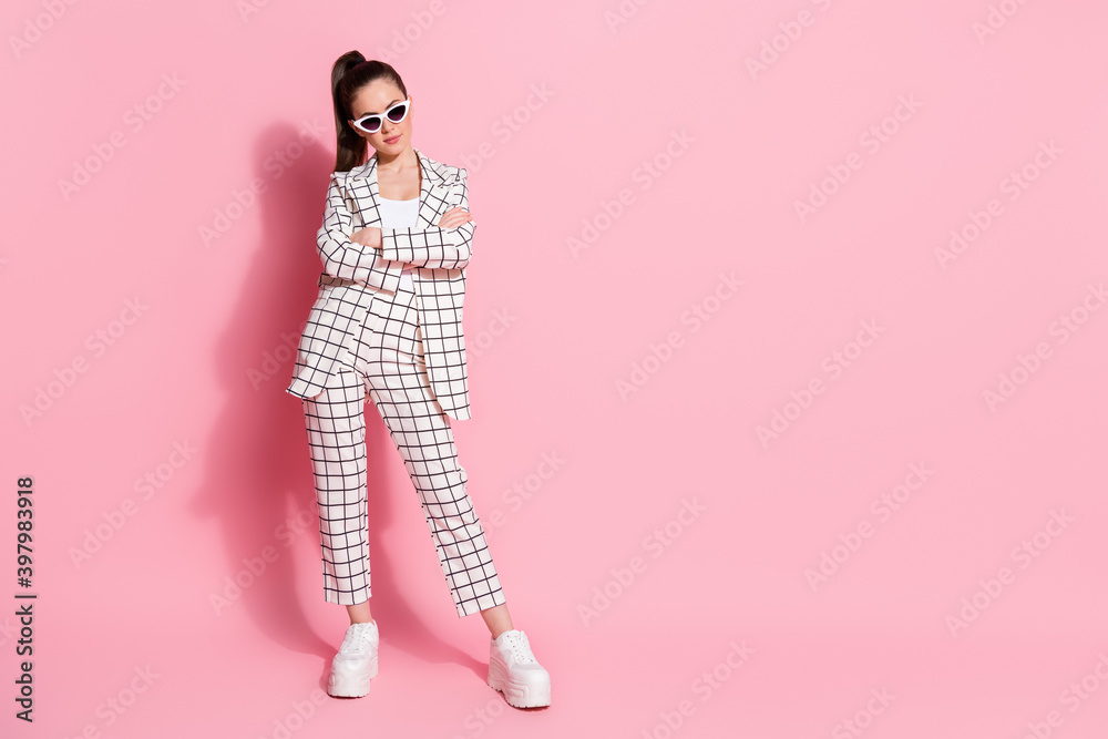 Full length photo of young attractive woman confident folded arms wear suit isolated over pink color background Full length photo of young attractive woman confident folded arms wear suit isolated over pink color background