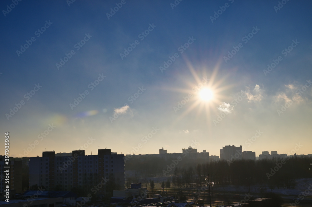 Photo of the sky with the sun. Morning city landscape.