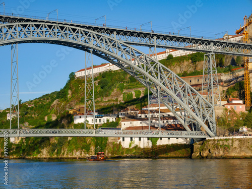Ponte Luis bridge in Porto as a rabelo boat passes underneath © Jason Row Photo