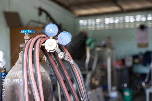 Gas cylinders and pressure gauges used in mechanics photo