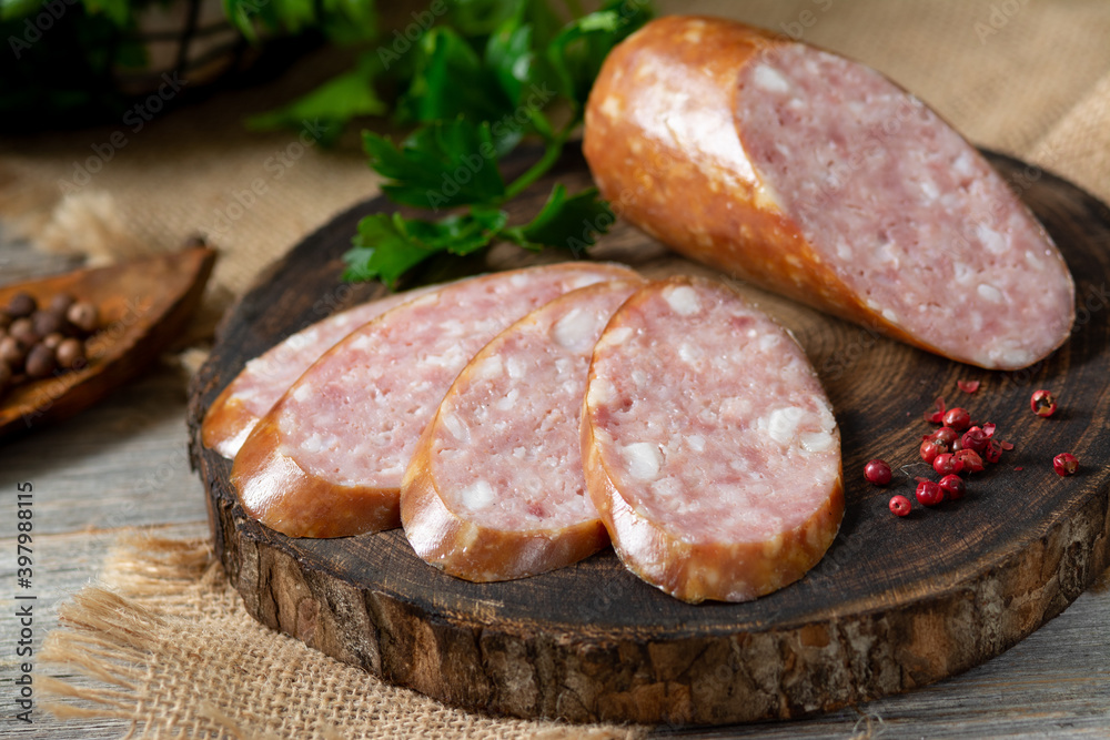 Sausage. Smoked sausage with spices on a wooden serving Board. Tasty meat sausages made from turkey meat. Copyspace Sausage. Smoked sausage with spices on a wooden serving Board. Tasty meat sausages made from turkey meat. Copyspace